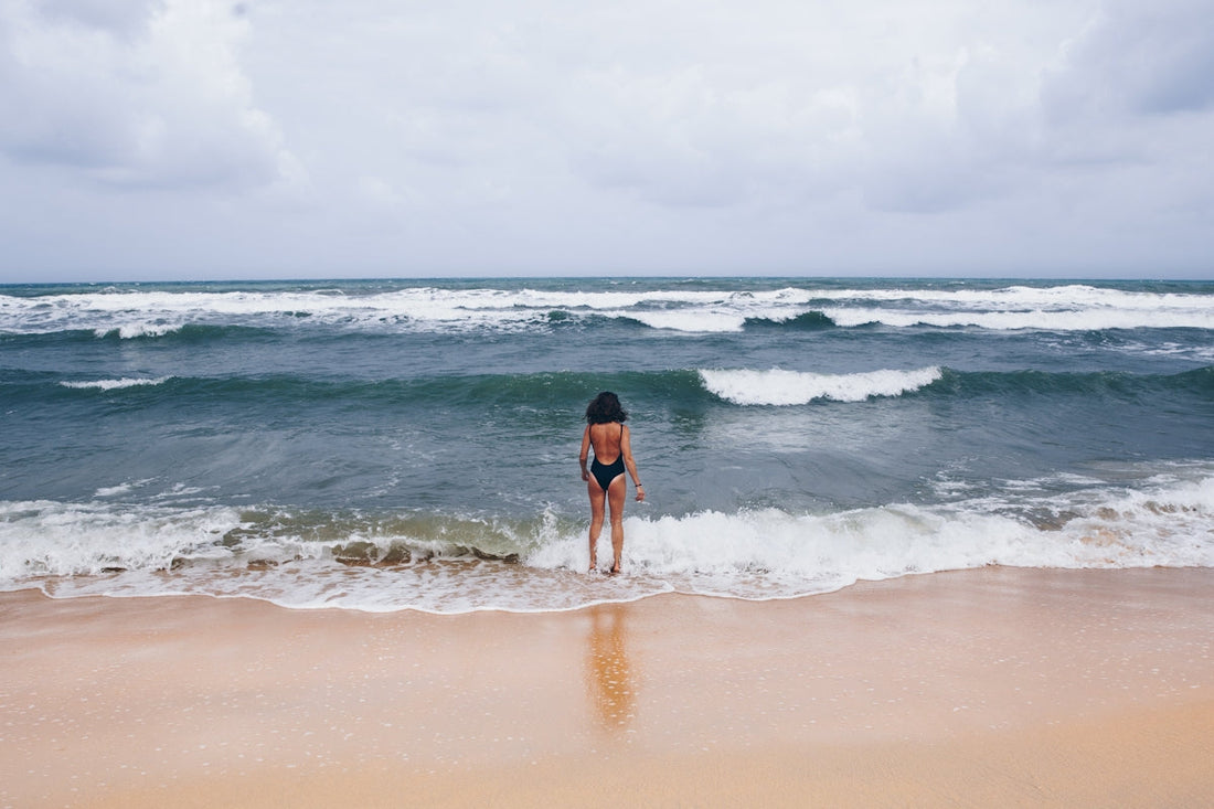 women wearing bathing suit on the beach