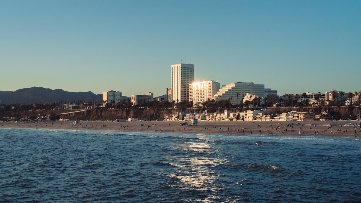 a beach with a city in the background