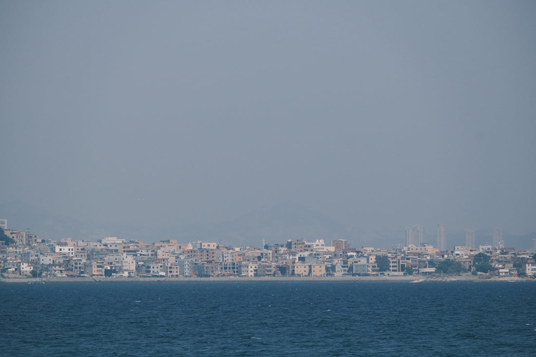 Coastal city skyline with buildings along the water