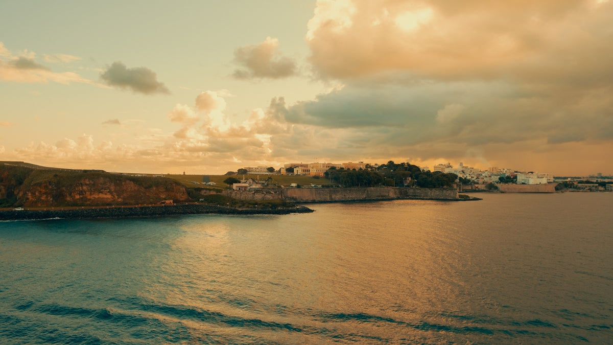 Coastal town on a calm sea at sunset